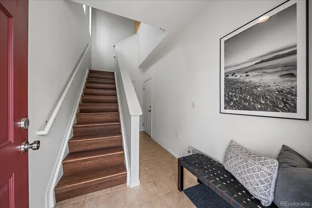 a room with furniture and stairs