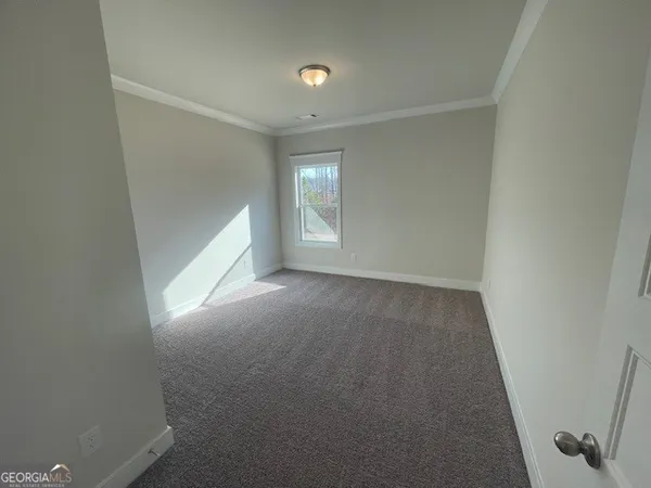 a view of a livingroom with a ceiling fan and window
