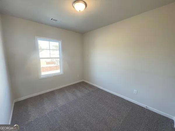 a view of a building with a window and a ceiling fan
