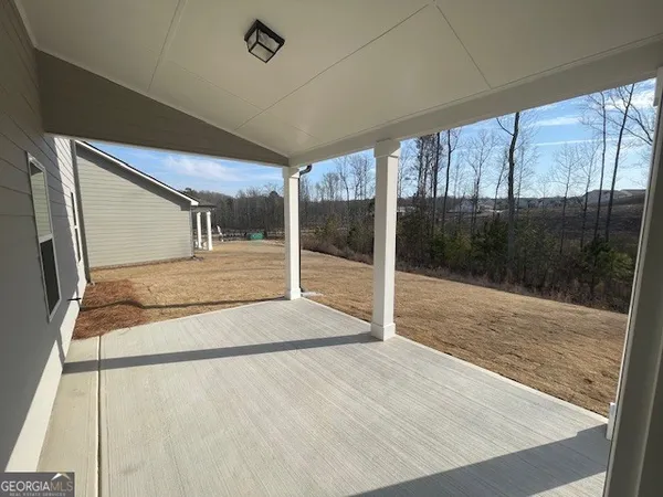 a front view of a building and car parked