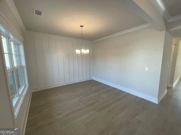 a kitchen with sink and cabinets