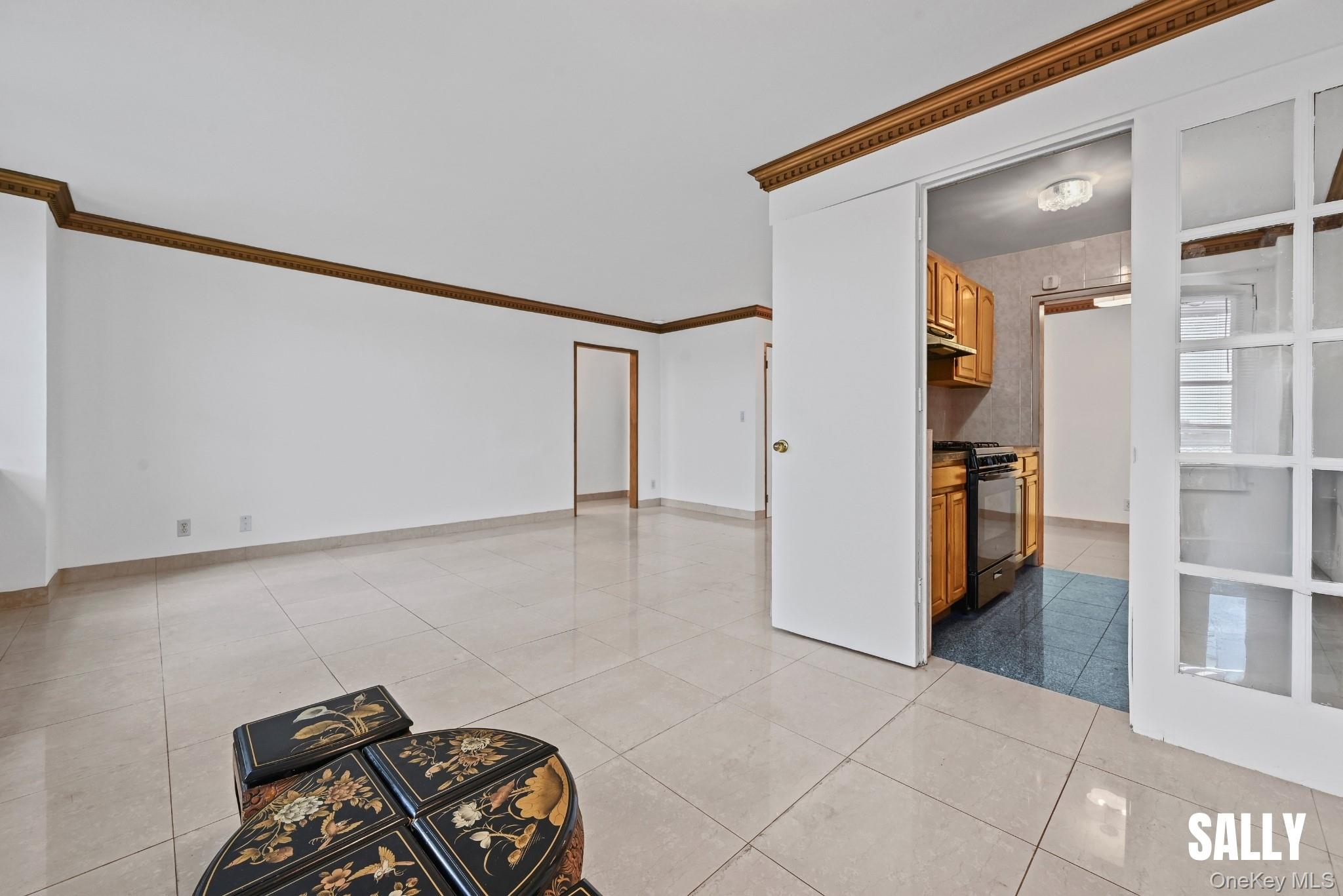 138-10 Franklin Avenue, Unit 12A Queens, NY 11355 - Photo 6 of 20 a view of a hallway to closet with wooden floor