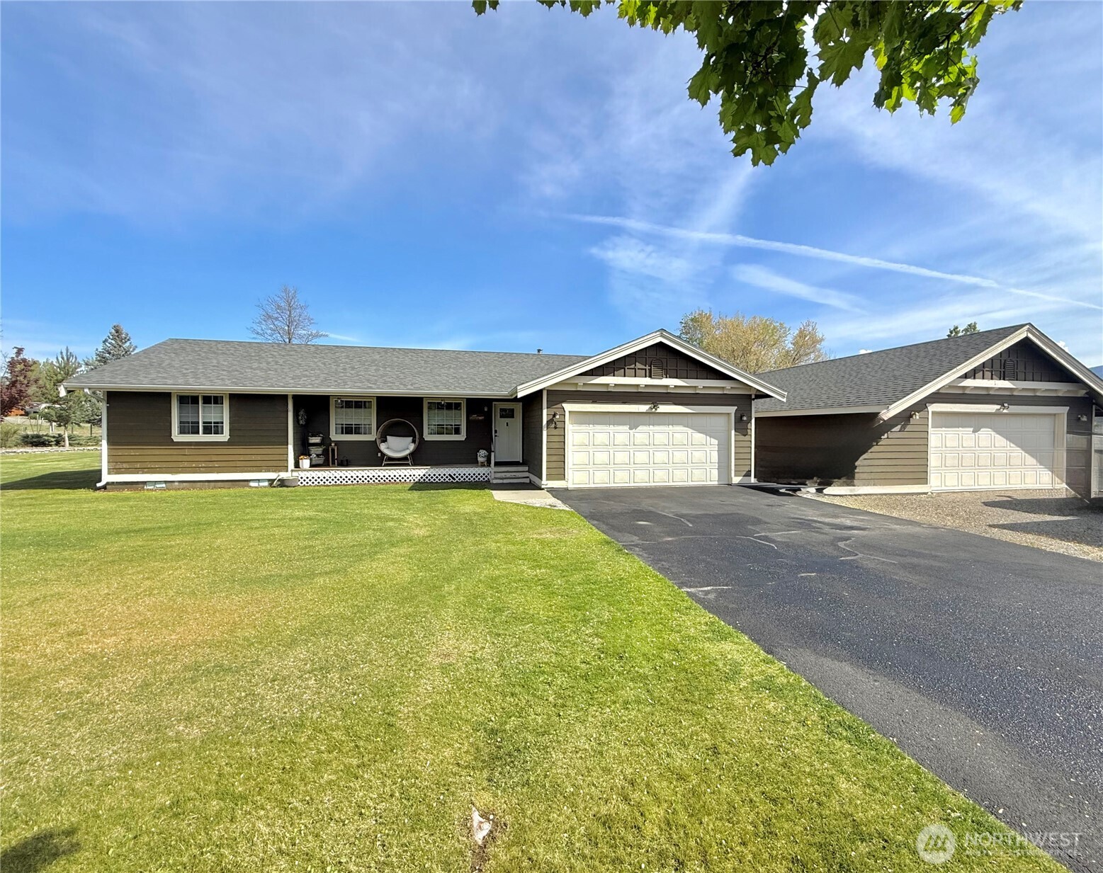 4 River Overlook Omak, WA 98841 - Photo 2 of 40 a front view of a house with a yard and garage