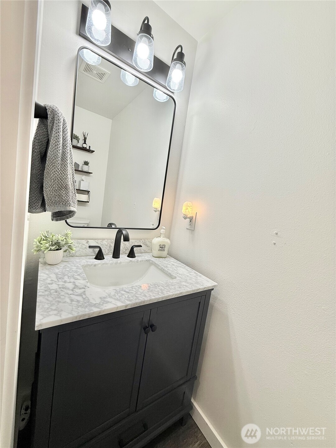 4 River Overlook Omak, WA 98841 - Photo 34 of 40 a bathroom with a granite countertop sink and a mirror