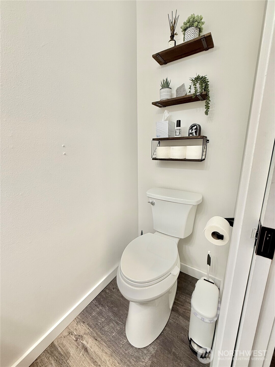 4 River Overlook Omak, WA 98841 - Photo 35 of 40 a white toilet sitting next to a shower and a wooden floor