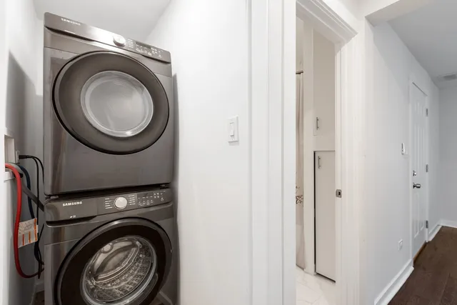 a view of a hallway with washer and dryer