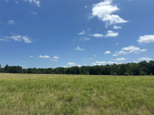 a view of a lake and sunset
