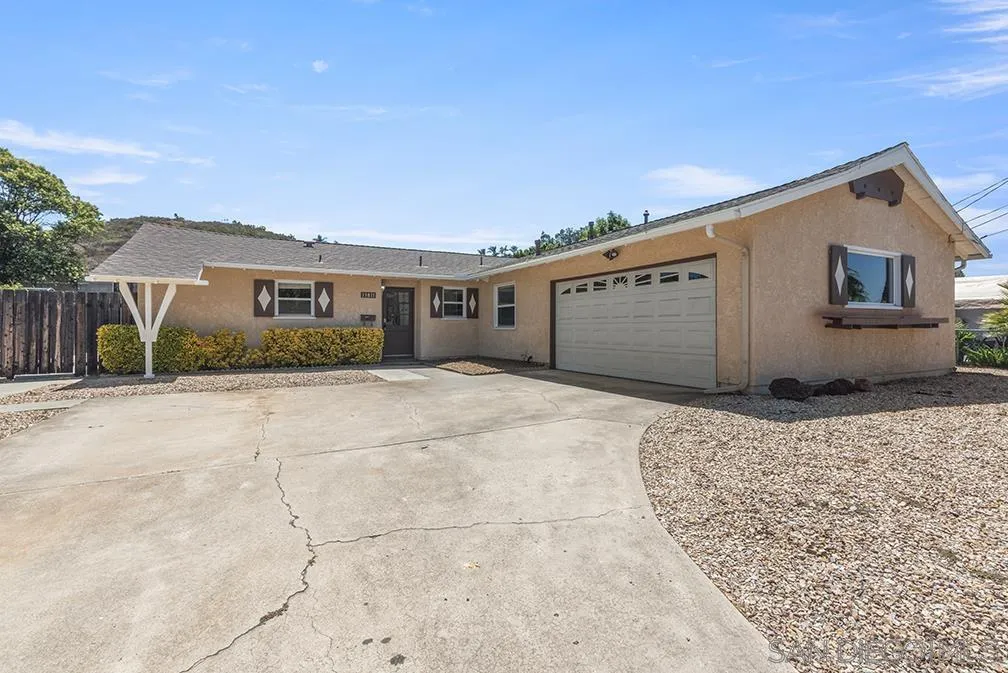 13811 Tobiasson Road Poway, CA 92064 - Photo 1 of 49 a front view of a house with a yard