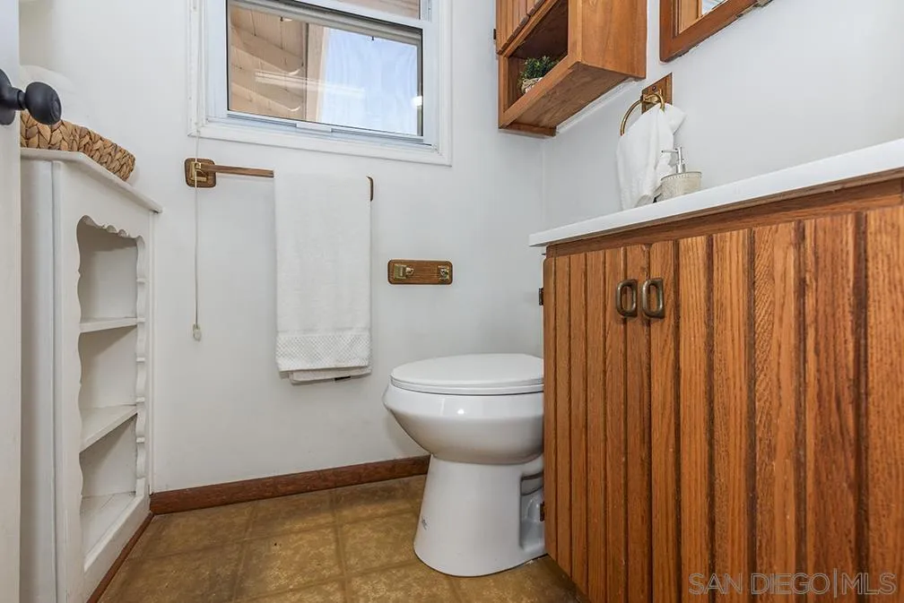 13811 Tobiasson Road Poway, CA 92064 - Photo 18 of 49 a bathroom with a toilet and a sink