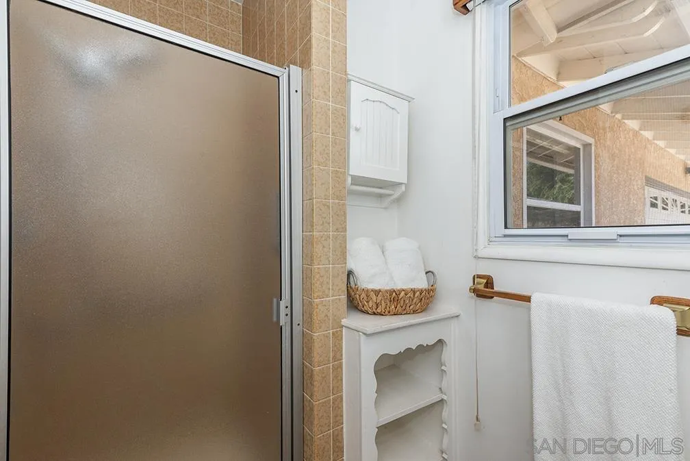 13811 Tobiasson Road Poway, CA 92064 - Photo 19 of 49 a bathroom with a sink and washing machine