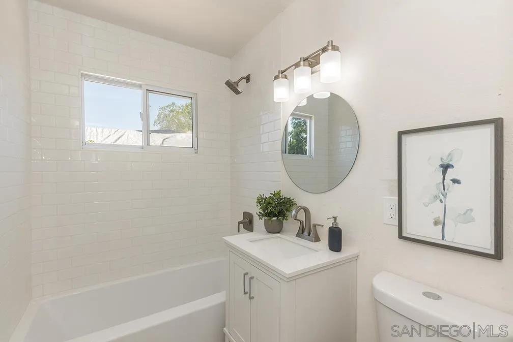 13811 Tobiasson Road Poway, CA 92064 - Photo 20 of 49 a bathroom with a toilet a sink and a mirror