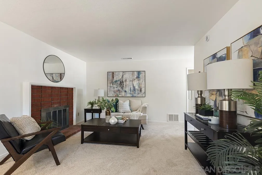 13811 Tobiasson Road Poway, CA 92064 - Photo 26 of 49 a living room with furniture and a fireplace