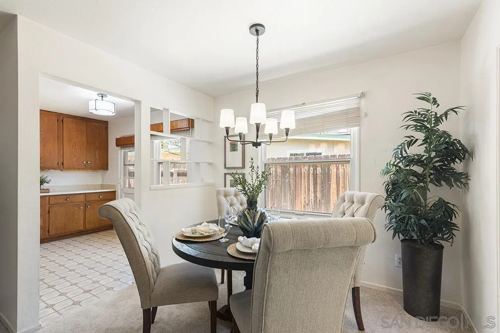 13811 Tobiasson Road Poway, CA 92064 - Photo 29 of 49 a view of a dining room with furniture window and wooden floor