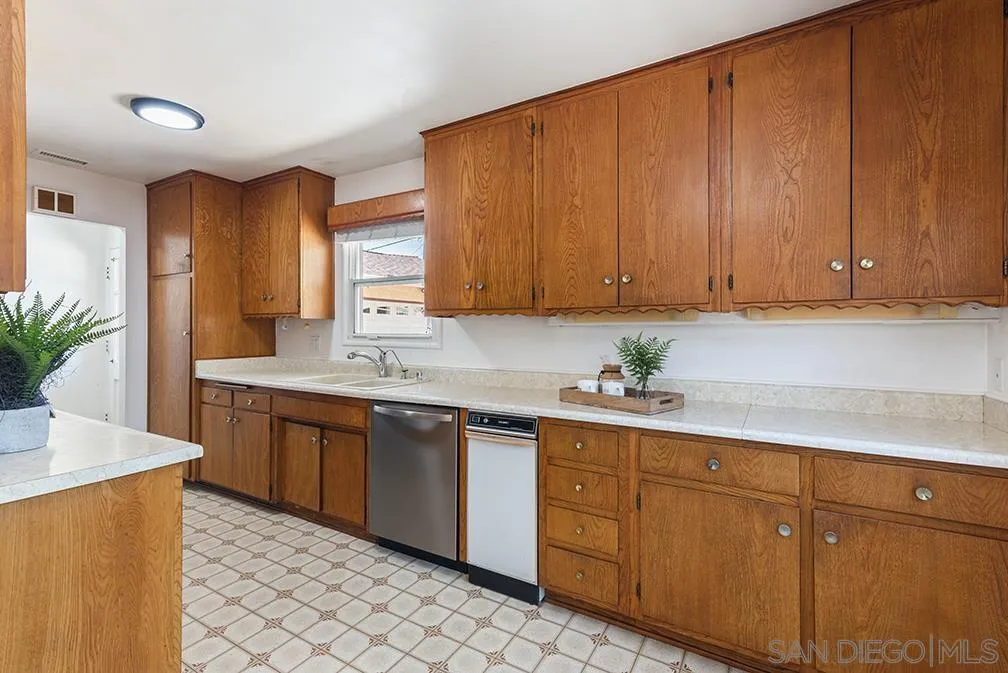 13811 Tobiasson Road Poway, CA 92064 - Photo 33 of 49 a kitchen with sink cabinets and window