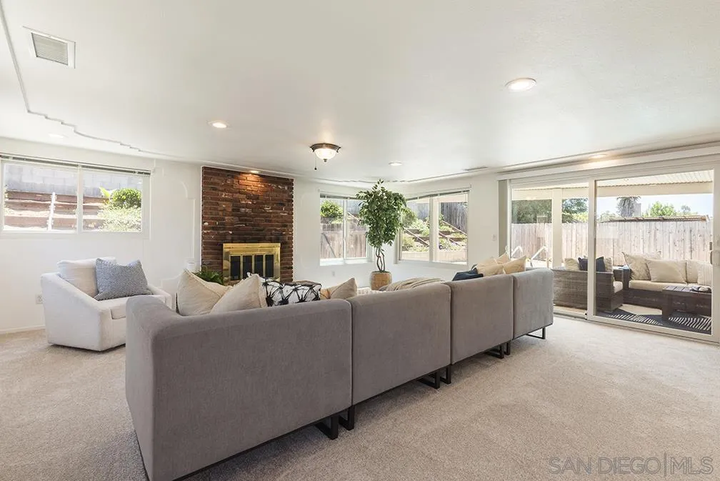 13811 Tobiasson Road Poway, CA 92064 - Photo 35 of 49 a living room with fireplace furniture and a large window