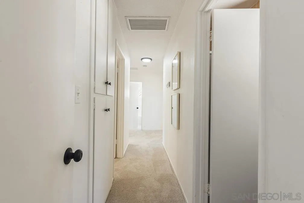 13811 Tobiasson Road Poway, CA 92064 - Photo 41 of 49 a view of a bathroom from a hallway
