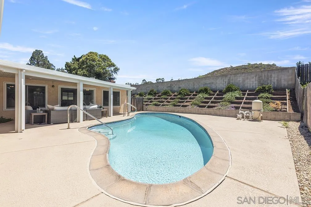 13811 Tobiasson Road Poway, CA 92064 - Photo 10 of 49 a view of a swimming pool with a yard