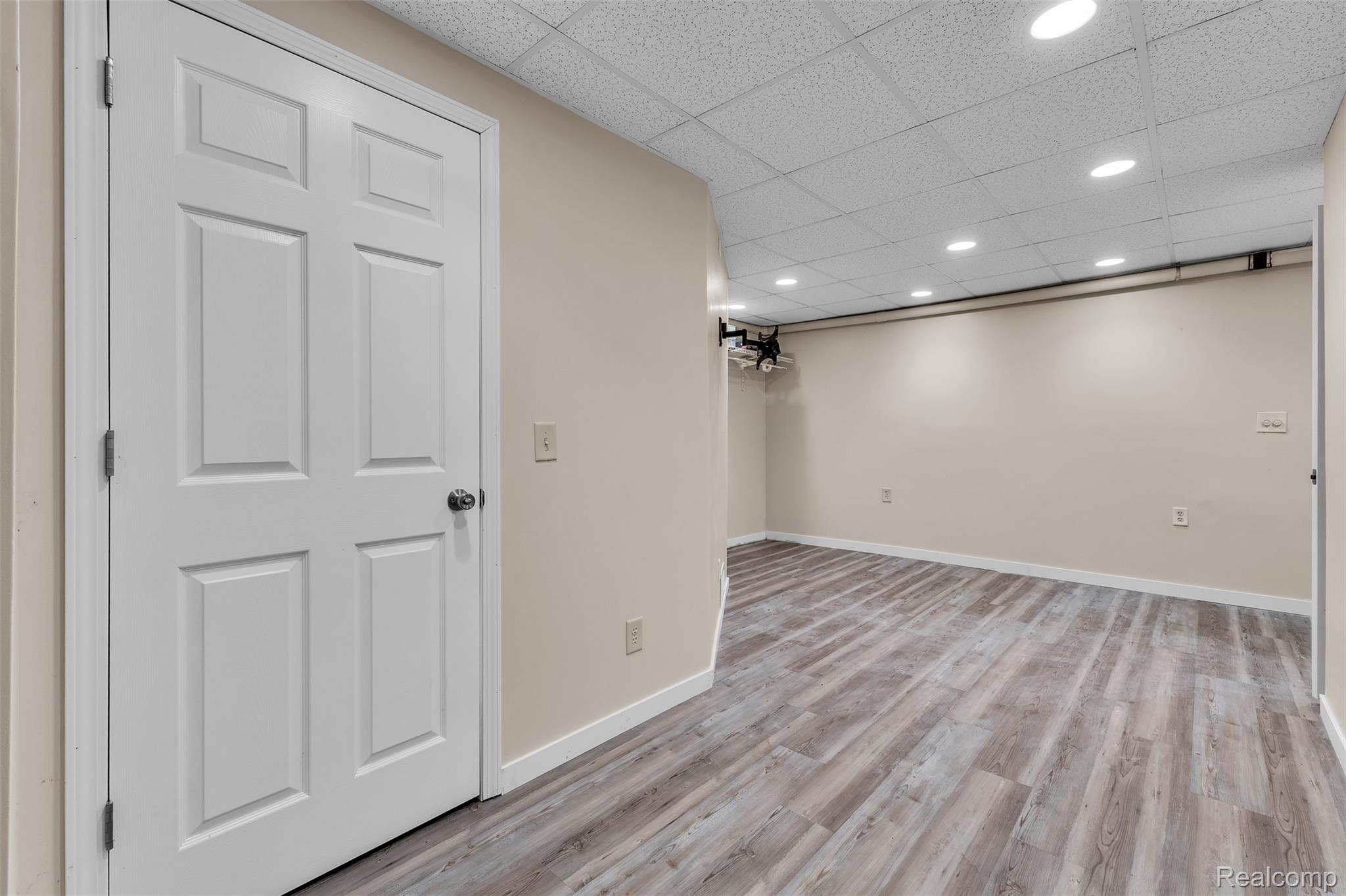 1345 Ives Road Mason, MI 48854 - Photo 42 of 92 Finished basement featuring a drop ceiling, light wood-style floors, and recessed lighting