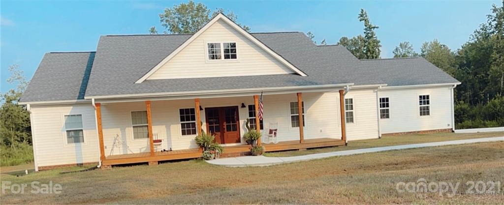 1344 Miles Road, Unit 2 Dallas, NC 28034 - Photo 1 of 1 a view of a house with wooden fence