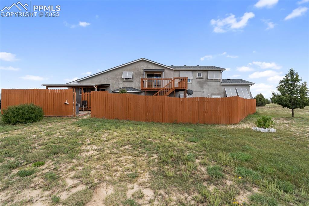 18895 Sage Crest Road Peyton, CO 80831 - Photo 35 of 38 a front view of a house with a yard