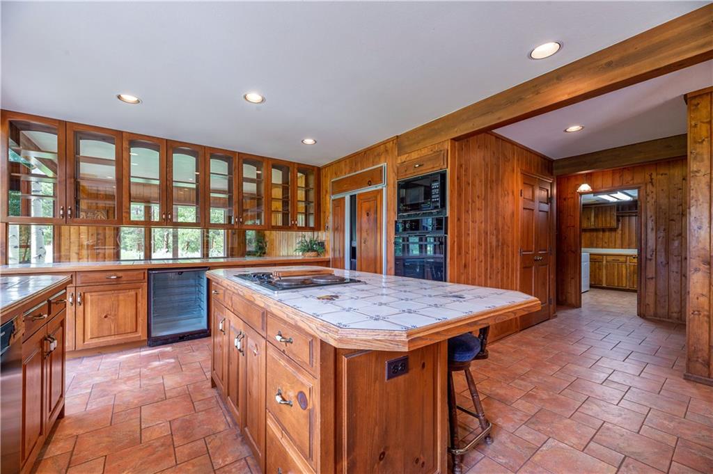 182 Penstemon Road Dillon, CO 80435 - Photo 22 of 35 a kitchen that has a lot of cabinets in it