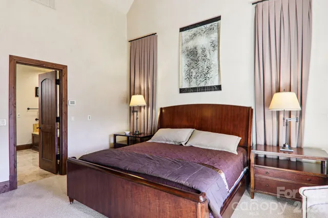 a bedroom with furniture and a window