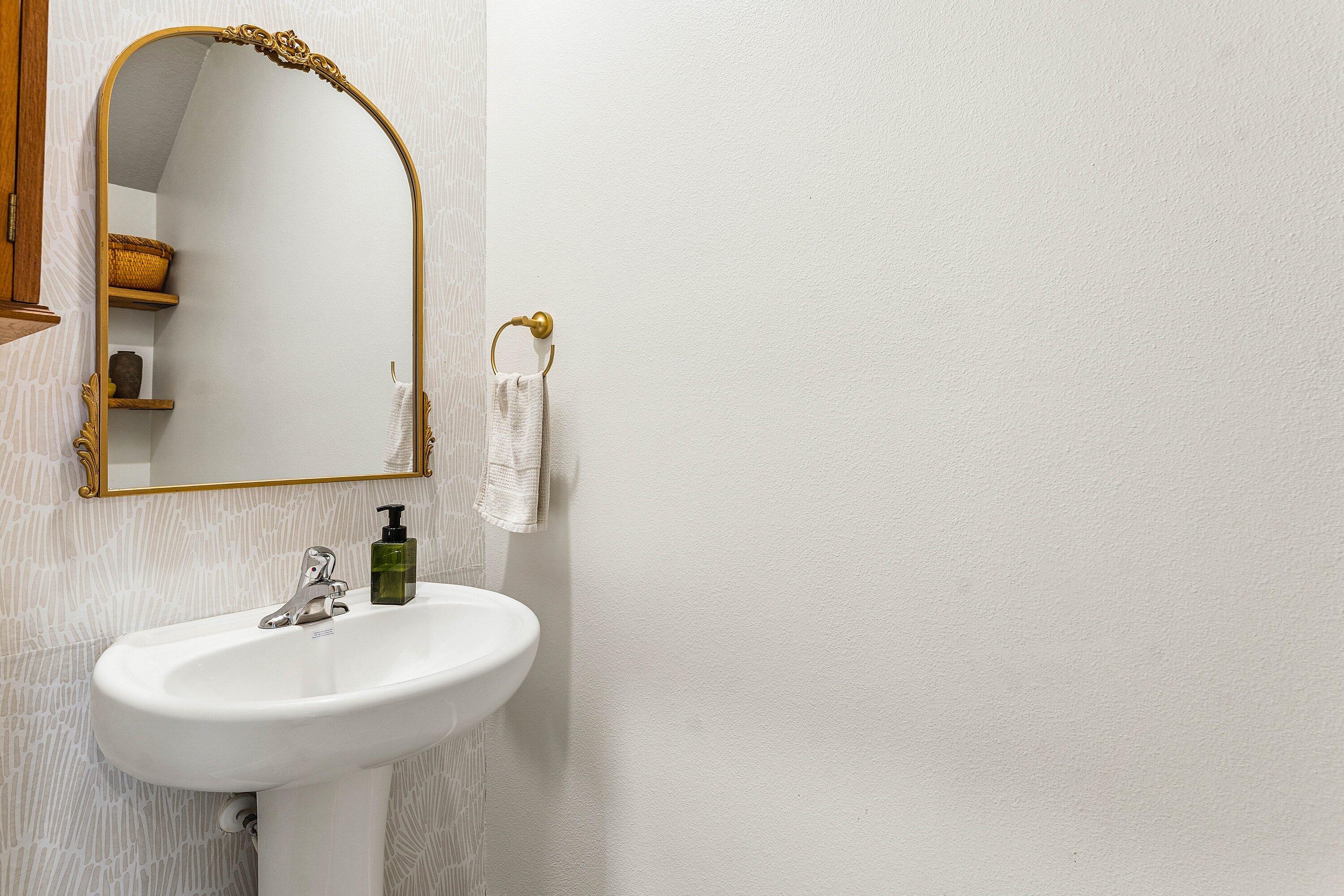 5739 Southeast Edgewater Circle Stuart, FL 34997 - Photo 11 of 29 a bathroom with a sink and a mirror