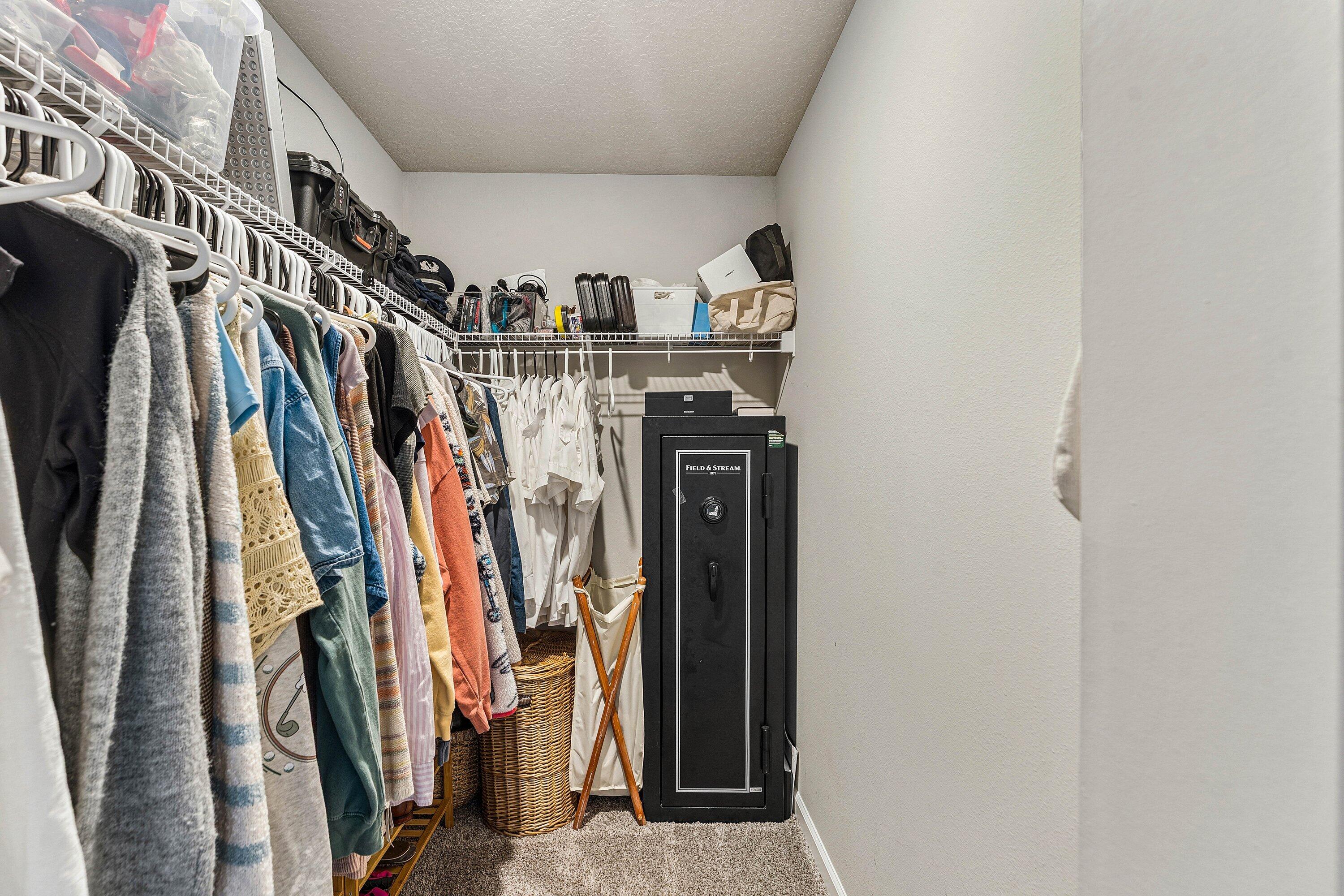 5739 Southeast Edgewater Circle Stuart, FL 34997 - Photo 16 of 29 a view of walk in closet with clothes and shoes