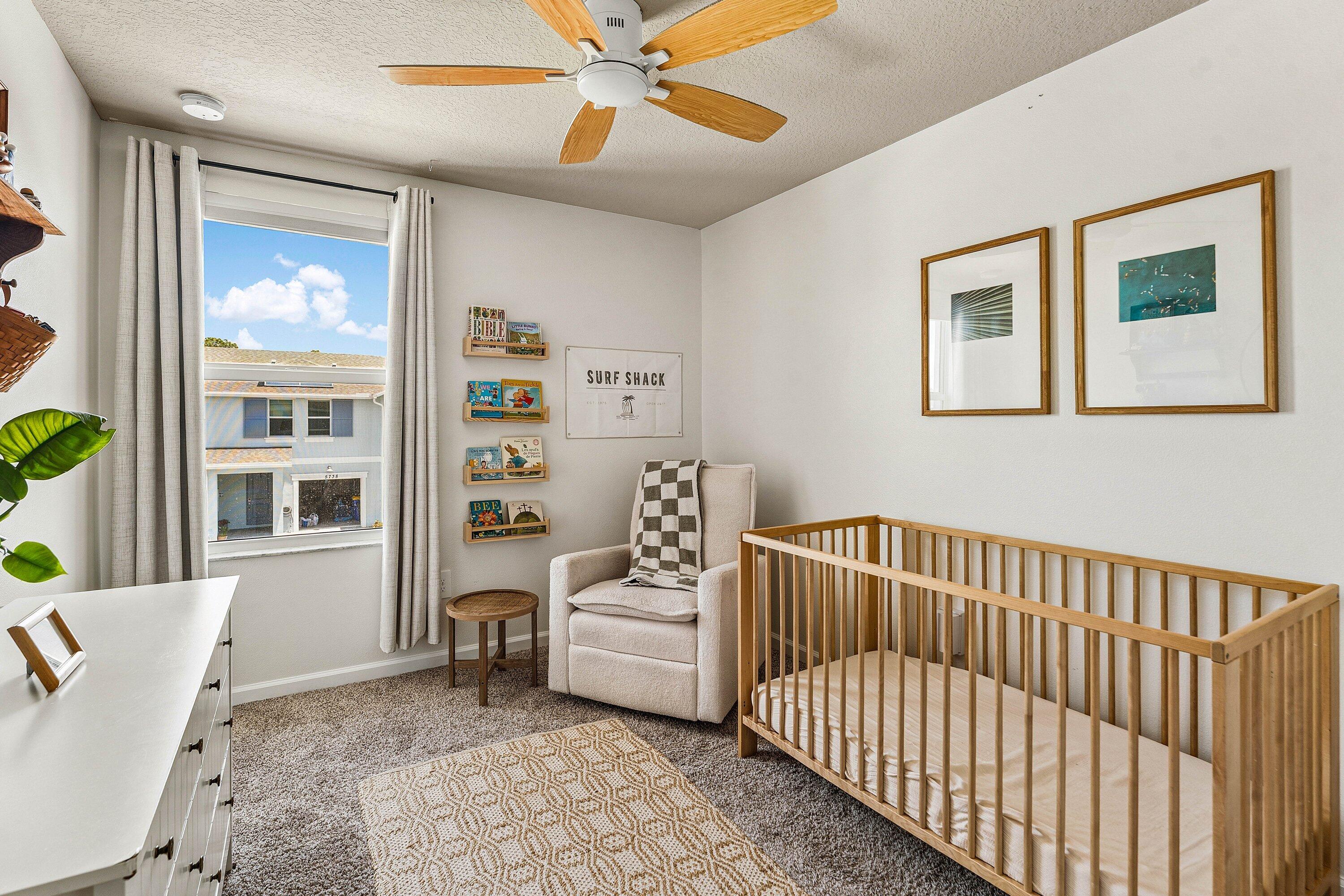 5739 Southeast Edgewater Circle Stuart, FL 34997 - Photo 18 of 29 a bedroom with furniture and a window