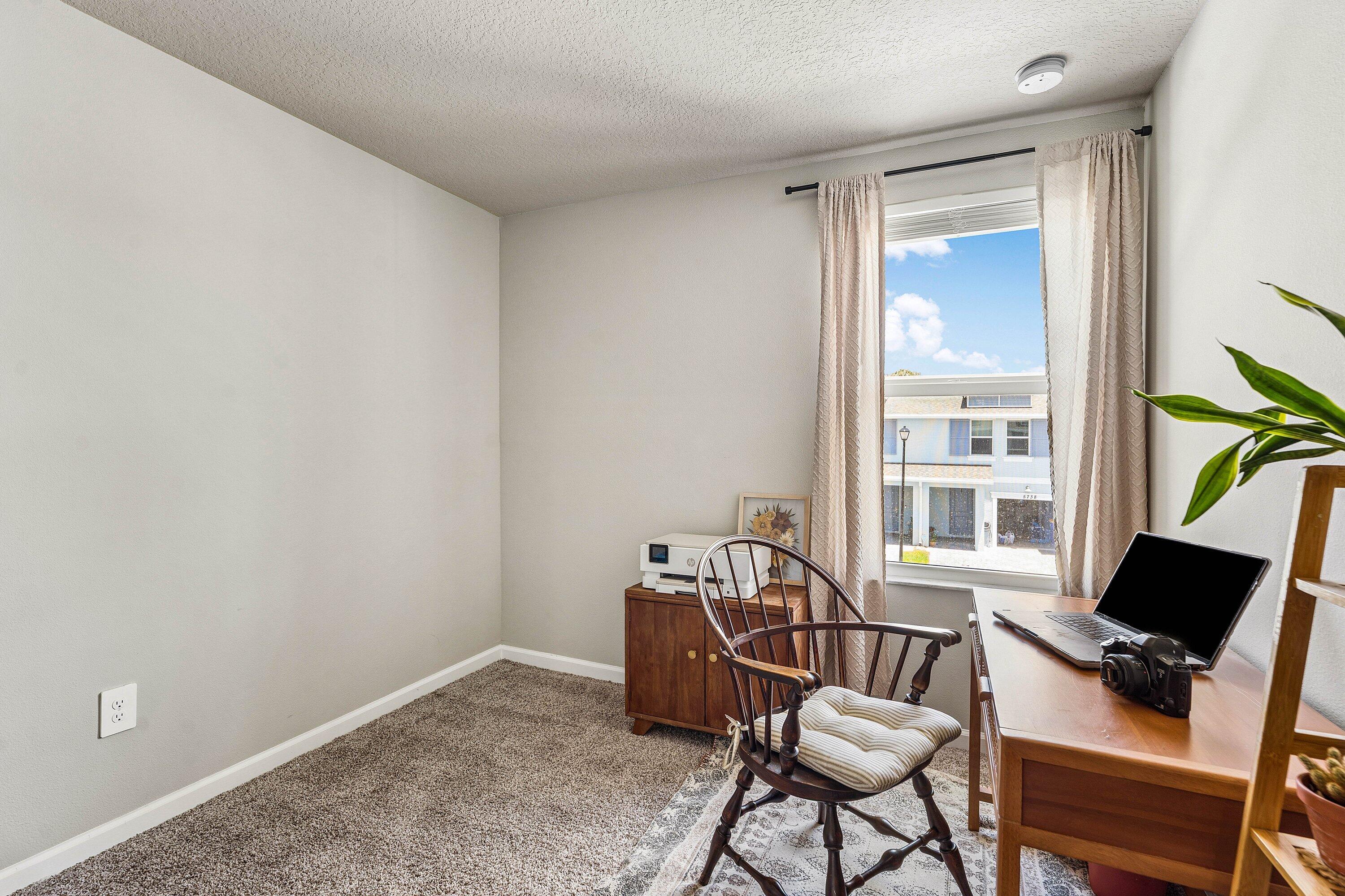 5739 Southeast Edgewater Circle Stuart, FL 34997 - Photo 20 of 29 a work room with furniture and a window