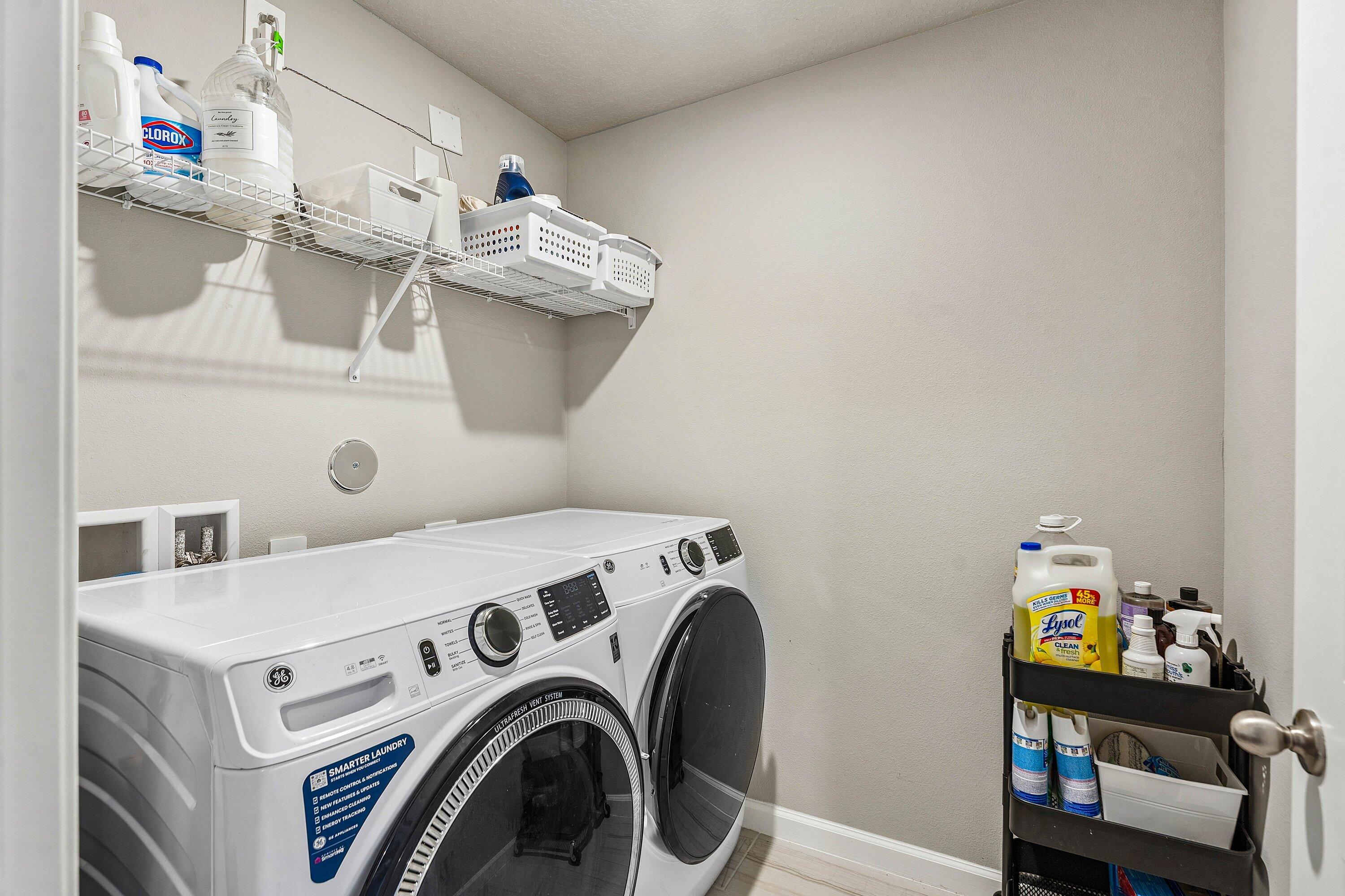 5739 Southeast Edgewater Circle Stuart, FL 34997 - Photo 21 of 29 a utility room with dryer and washer