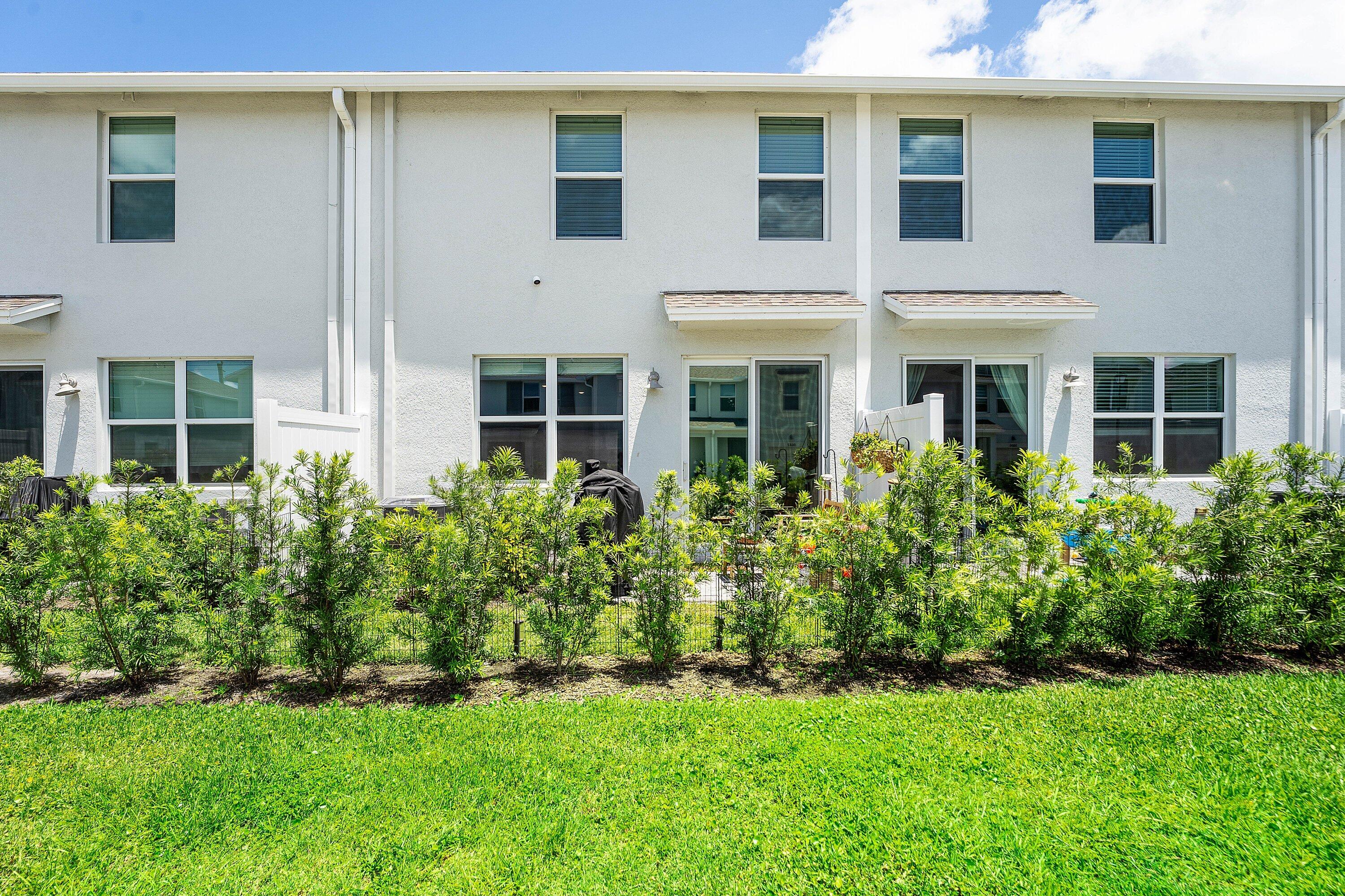 5739 Southeast Edgewater Circle Stuart, FL 34997 - Photo 24 of 29 a view of a house with a yard