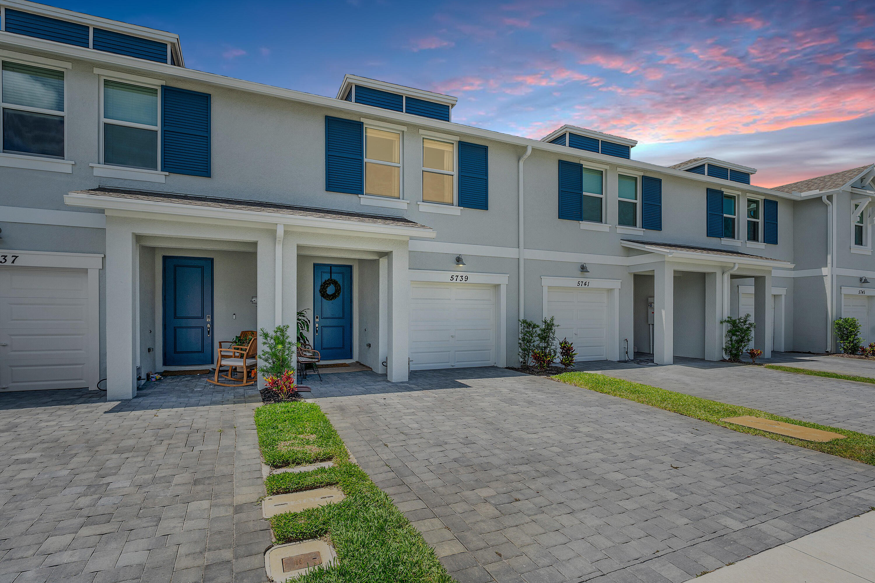 5739 Southeast Edgewater Circle Stuart, FL 34997 - Photo 29 of 29 a front view of a building with a yard