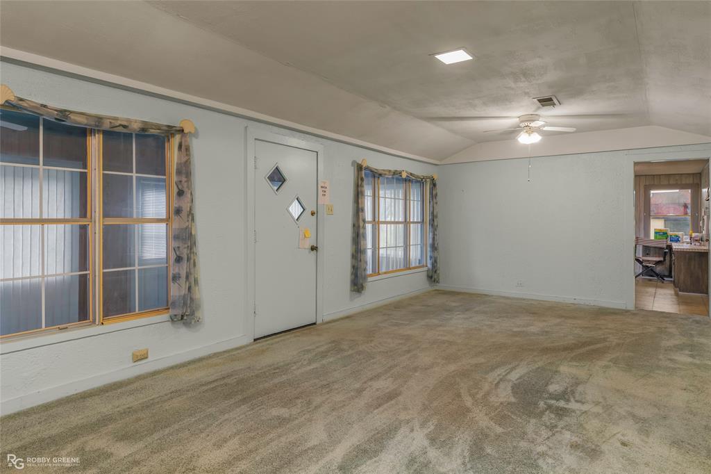 302 Princeton Road Princeton, LA 71067 - Photo 13 of 33 an empty room with cabinet and windows