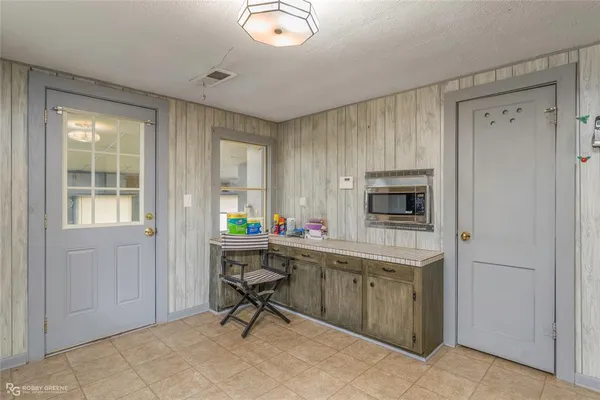 a kitchen with sink and cabinets