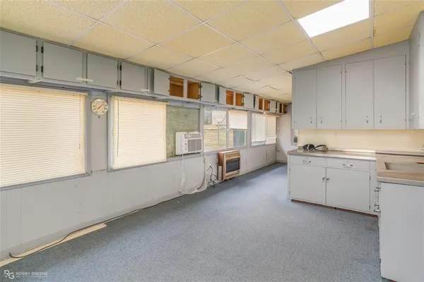 a view of a bathroom with a sink and mirror