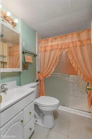 a view of a room with a ceiling fan