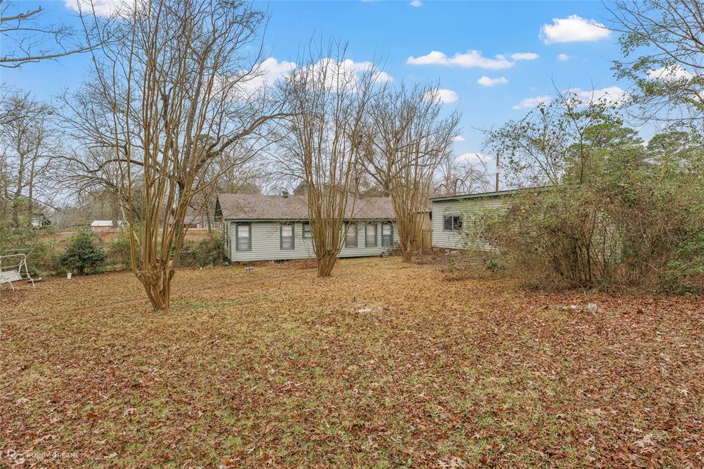 302 Princeton Road Princeton, LA 71067 - Photo 9 of 33 a house with trees in front of it