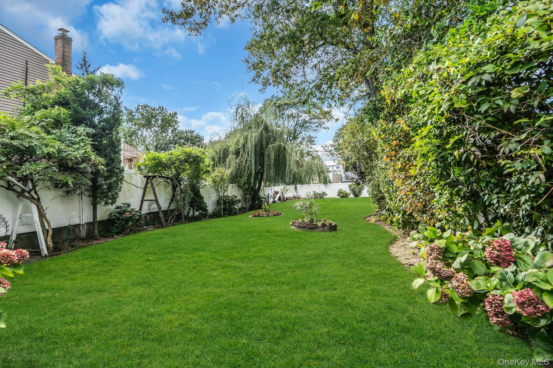 2730 Remsen Street Baldwin, NY 11510 - Photo 3 of 31 View of fenced backyard