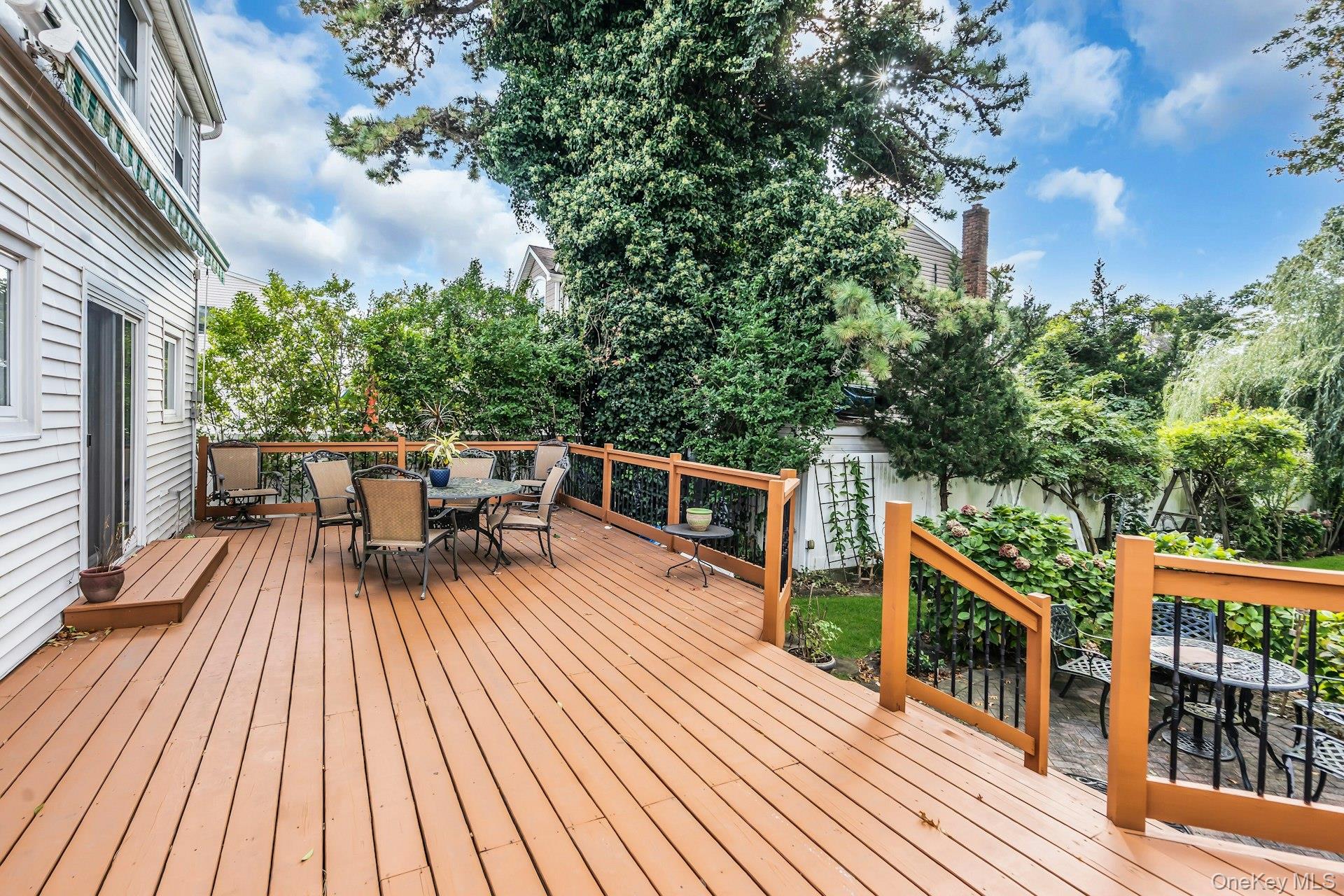2730 Remsen Street Baldwin, NY 11510 - Photo 4 of 31 Wooden deck with outdoor dining space