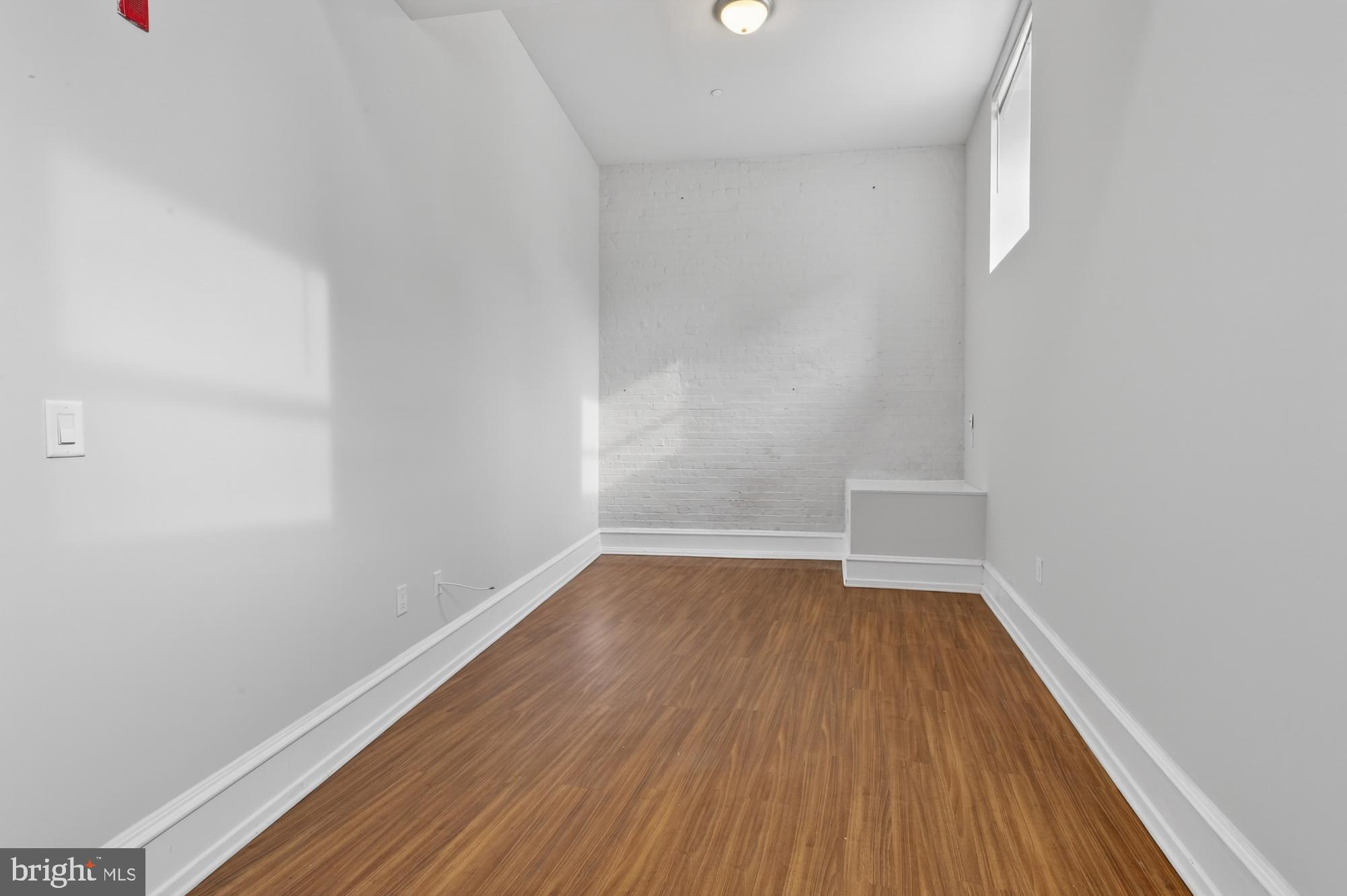 2136 East Dauphin Street, Unit 101 Philadelphia, PA 19125 - Photo 22 of 30 a view of room with wooden floor