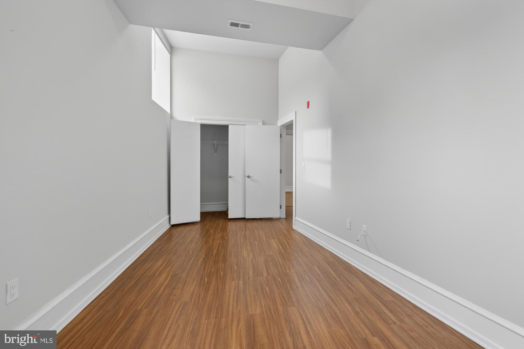 2136 East Dauphin Street, Unit 101 Philadelphia, PA 19125 - Photo 23 of 30 a view of an empty room with wooden floor