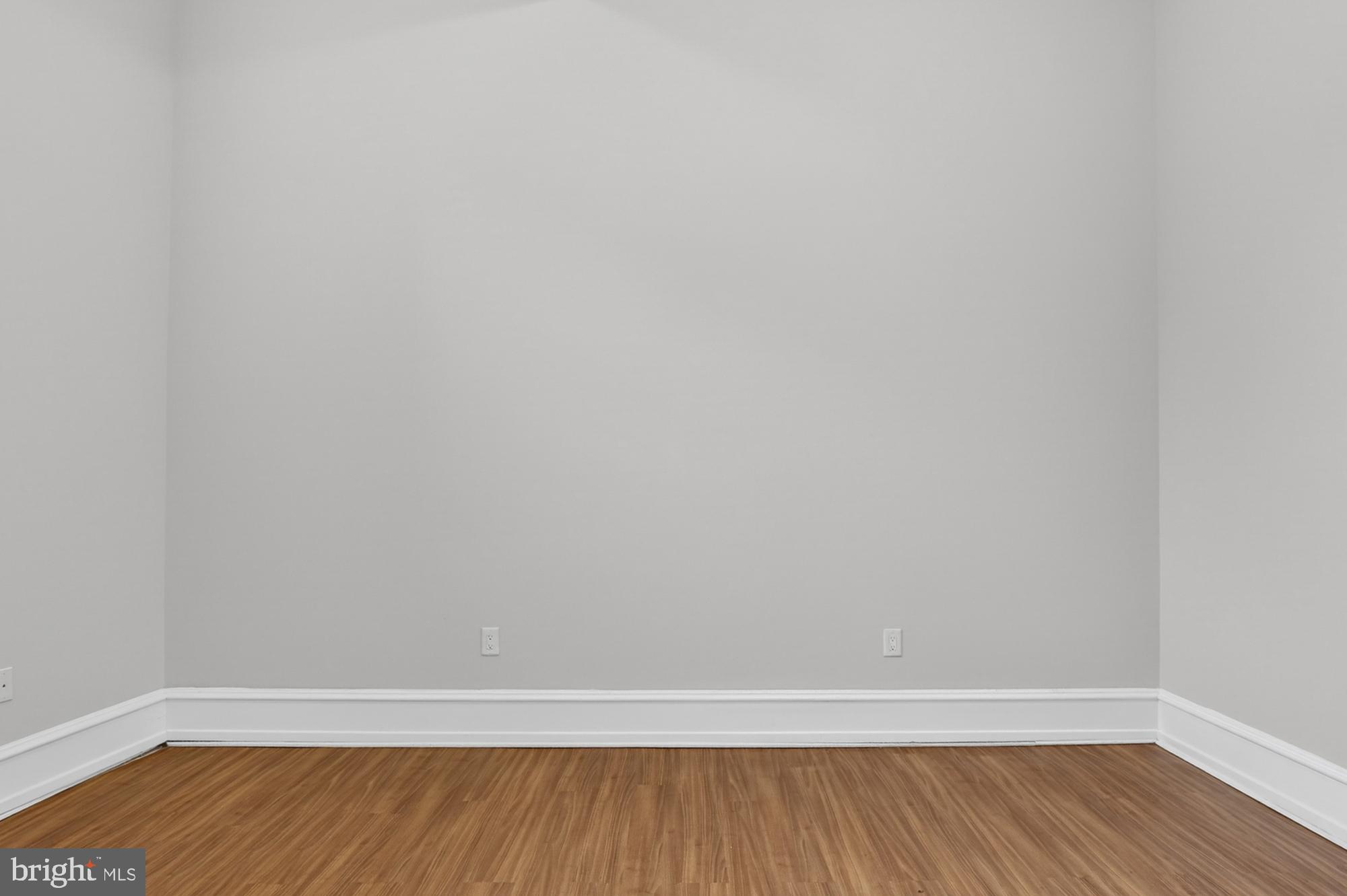 2136 East Dauphin Street, Unit 101 Philadelphia, PA 19125 - Photo 24 of 30 a view of an empty room with wooden floor
