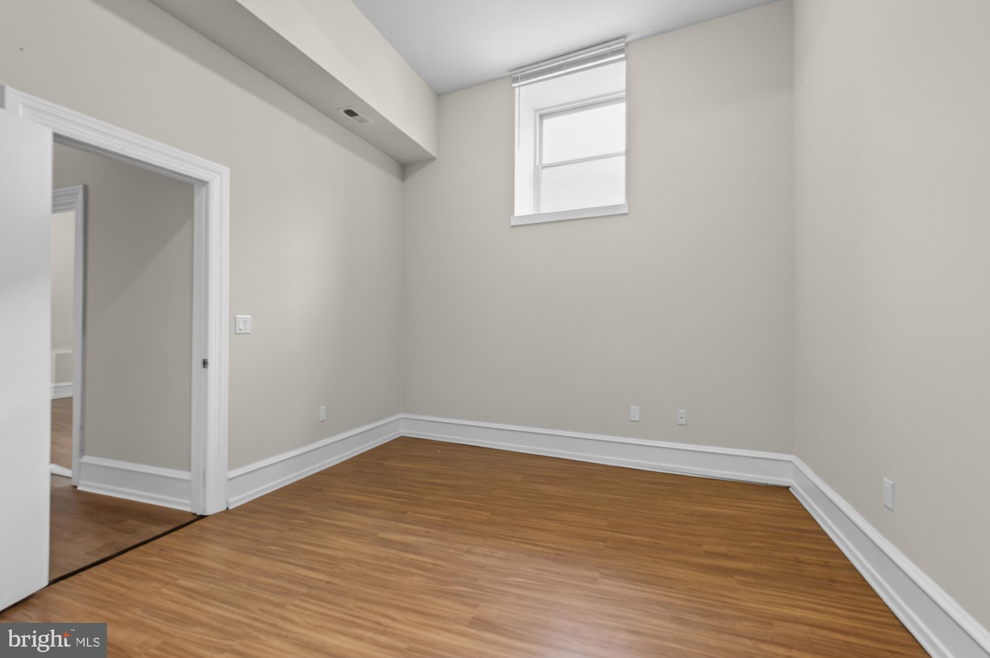 2136 East Dauphin Street, Unit 101 Philadelphia, PA 19125 - Photo 25 of 30 wooden floor in an empty room