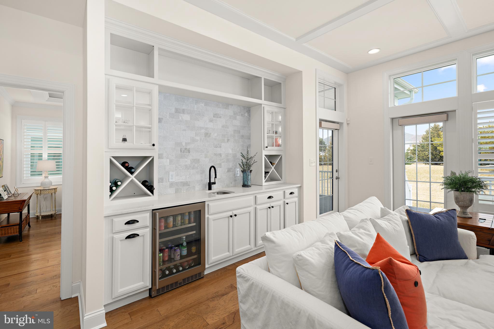 11119 Marvil Road, Unit 93 Lewes, DE 19958 - Photo 11 of 52 a living room with furniture white cabinets and wooden floor