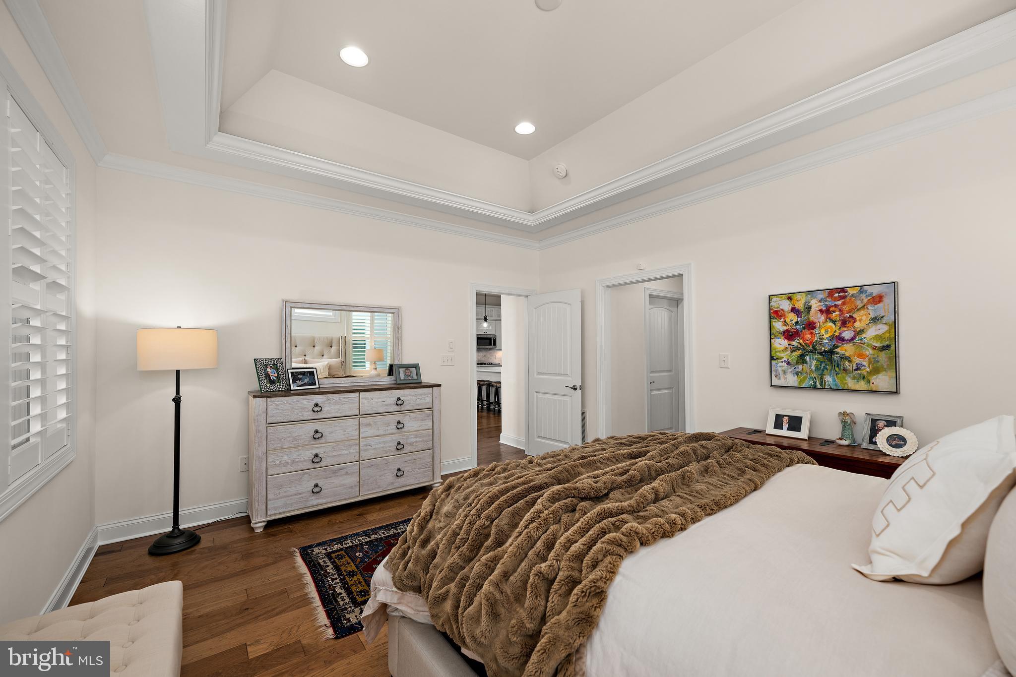 11119 Marvil Road, Unit 93 Lewes, DE 19958 - Photo 22 of 52 a bedroom with a bed and a cabinets