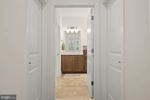 a view of a bathroom from a hallway