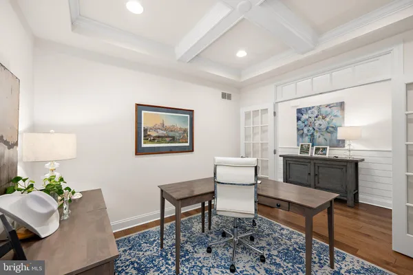 a living room with furniture a rug and a window