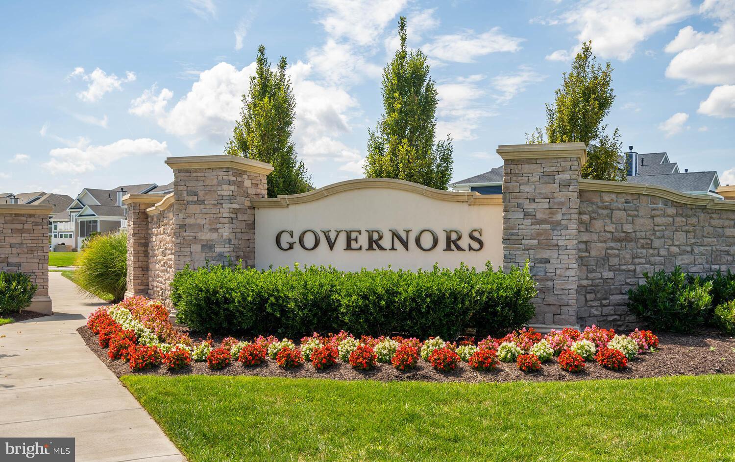 11119 Marvil Road, Unit 93 Lewes, DE 19958 - Photo 3 of 52 a view of a house with a big yard and large trees