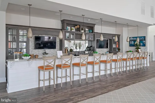 a living room with lots of furniture and a chandelier